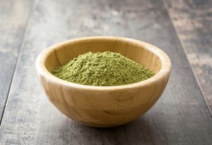 Thumbnail-For-Kratom-Powder-On-A-Wooden-Bowl-By-Kinkg K. Kratom