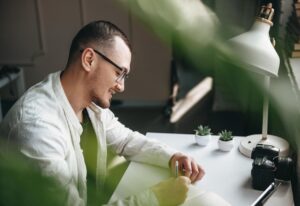 Thumbnail-For-Man-Smiling-At-Desk-Kratom-Benefits-By-King K. Kratom